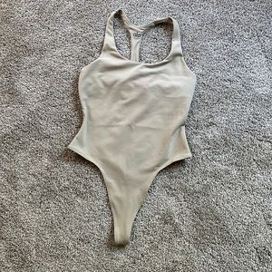 Beautiful bodysuit by alo yoga in limited edition sand color